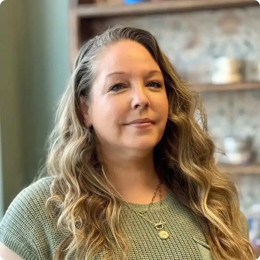 Mollie, Treatment Coordinator, smiling gently in a professional portrait at Beaverton Orthodontics in Beaverton, OR